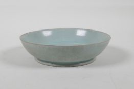 A Chinese celadon Ru ware style porcelain dish, engraved character inscription to base, 5½" diameter