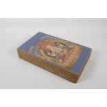 A Tibetan printed concertina book depicting various images of thangkas, 6" x 11"