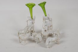 Two C19th Parian figures of cherubs, with green glass epergne flutes on their backs. 5" high,