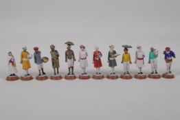 Twelve Indian painted terracotta figures, depicting various professions, AF, largest 3½"