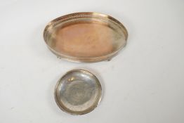 A small oval silver plated gallery tray, 9" x 6", together with an eastern silver dish, unmarked. (