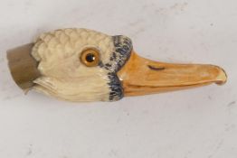 A C19th carved and dyed ivory parasol handle, carved as a ducks head. 2½" long