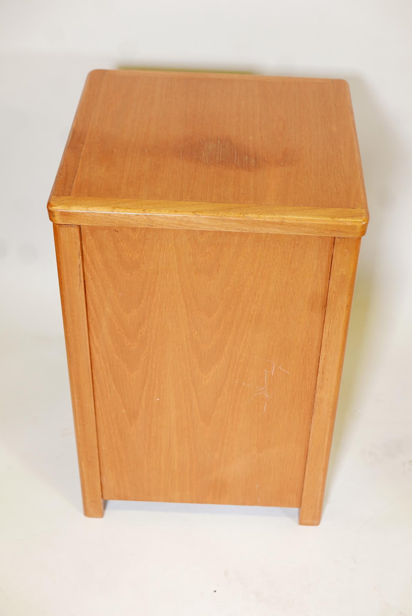 A 1960's teak laundry box, with military style brass handles. 23" x 15" x 15"