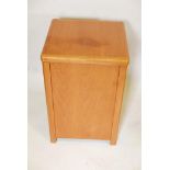 A 1960's teak laundry box, with military style brass handles. 23" x 15" x 15"