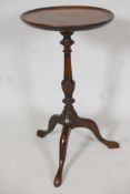 A mahogany wine table, with circular top on turned and carved column. With tripod base. 21" high x