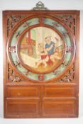 A Chinese painted & carved hardwood panel, decorated with boys playing with bangers. 25" x 36"