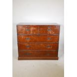C19th teak campaign chest in two sections, with brass mounts and military style recessed handles,