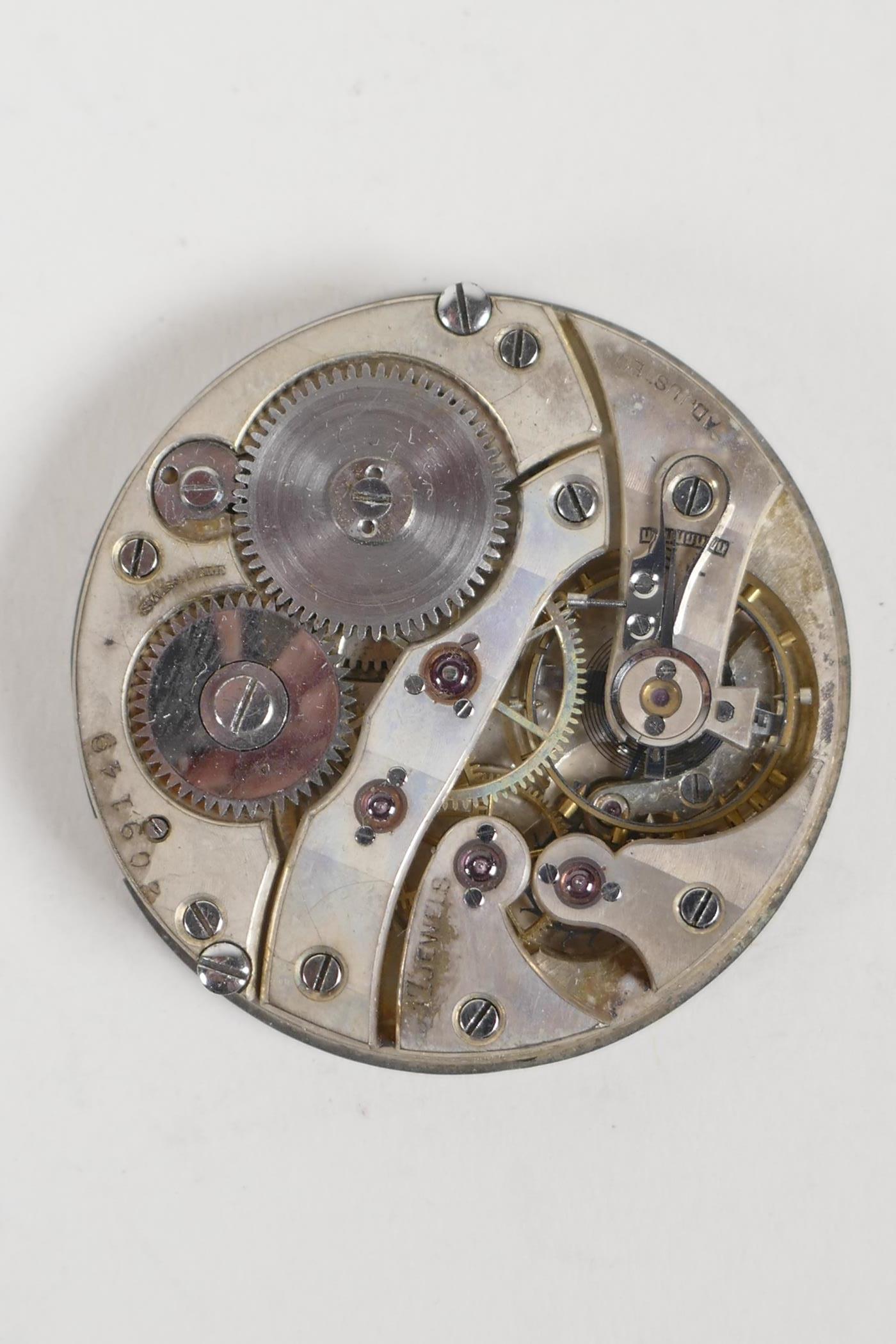 A Swiss made 17 jewel pocket watch movement, with an enamel face and a subsidiary second dial. - Image 5 of 5