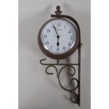 An ornamental garden clock thermometer on wrought iron bracket, (quartz movement), 6½" diameter