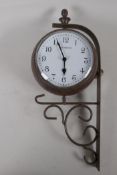 An ornamental garden clock thermometer on wrought iron bracket, (quartz movement), 6½" diameter