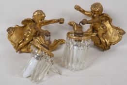 A pair of gilt plaster cherub, single light wall sconces. 9" wide