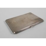 An engine turned hallmarked silver cigarette case by Charles Parker & Co Ltd, London, 1939, 182g, 5"