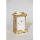 A Garrard & Co brass carriage clock, with bevelled glass panels, with key, 4½" high