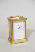 A Garrard & Co brass carriage clock, with bevelled glass panels, with key, 4½" high