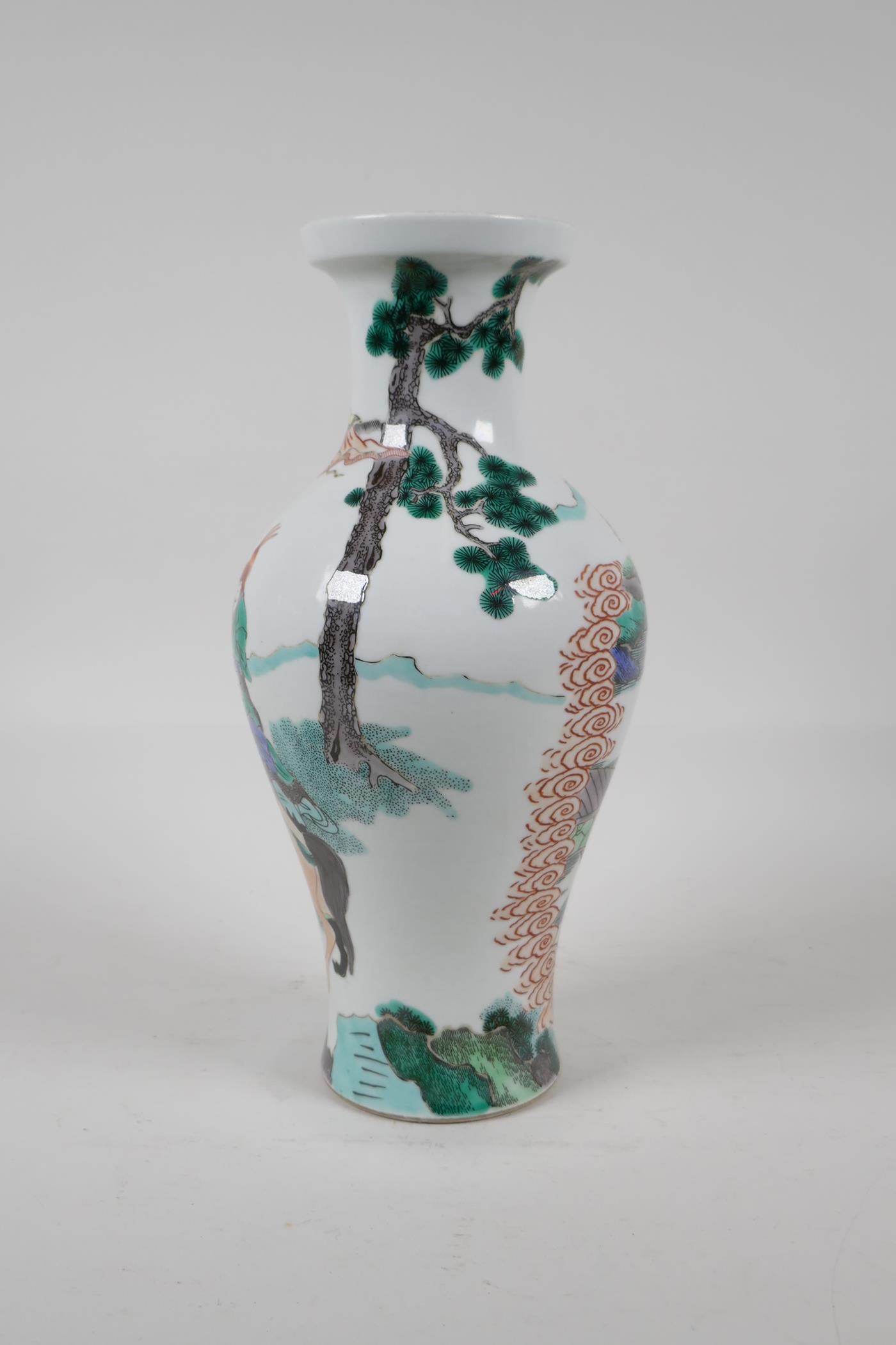 A Chinese Kangxi style famille verte porcelain vase decorated with travellers in a landscape, leaf - Image 4 of 5