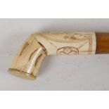 A C19th Marine ivory Scrimshaw walking stick handle, engraved with a young girl and four-leaf