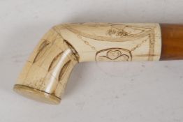 A C19th Marine ivory Scrimshaw walking stick handle, engraved with a young girl and four-leaf