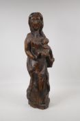 An antique oak carving of the Madonna & child, 22" high