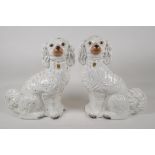 A pair of C19th white & gilt Staffordshire dogs, 12½" high