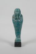 An Egyptian turquoise glazed Faience Shabti, 7" high