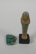 An Egyptian Faience pottery Shabti and a terracotta glazed amulet of Khum, largest 4" high