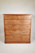 A tall C19th Mahogany chest of two short, over four graduated long drawers. With original brass drop