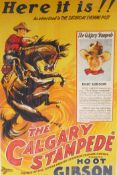 A framed film advertising poster for 'The Calgary Stampede', starring Hoot Gibson, directed by