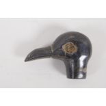 A small C19th horn parasol handle, carved as a birds head. 1½" long. AF