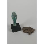 An Egyptian turquoise glazed Faience Shabti & a pottery token/amulet in the form of the eye of Ra.