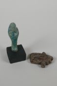 An Egyptian turquoise glazed Faience Shabti & a pottery token/amulet in the form of the eye of Ra.