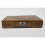 A Chinese ochre ground lacquer box with chased and painted decoration of dragons and character