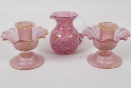 A pair of pink frosted glass candlesticks, 3½" high and a studio glass jug