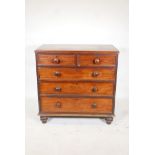 A early C19th mahogany chest, of 2 over 3 graduated drawers, raised on turned supports. 36" x 19½" x