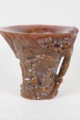 A Chinese faux horn libation cup, decorated with figures. Impressed seal mark to base. 4½" high