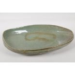 A George H Wilson, (1924 - 2004), studio pottery leaf shape dish, with a robins egg glaze. Signed to