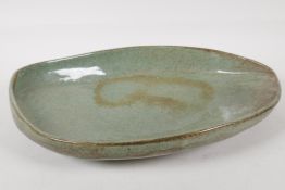 A George H Wilson, (1924 - 2004), studio pottery leaf shape dish, with a robins egg glaze. Signed to