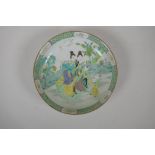 A Chinese famille verte porcelain dish decorated with women and children in a garden, 6 character