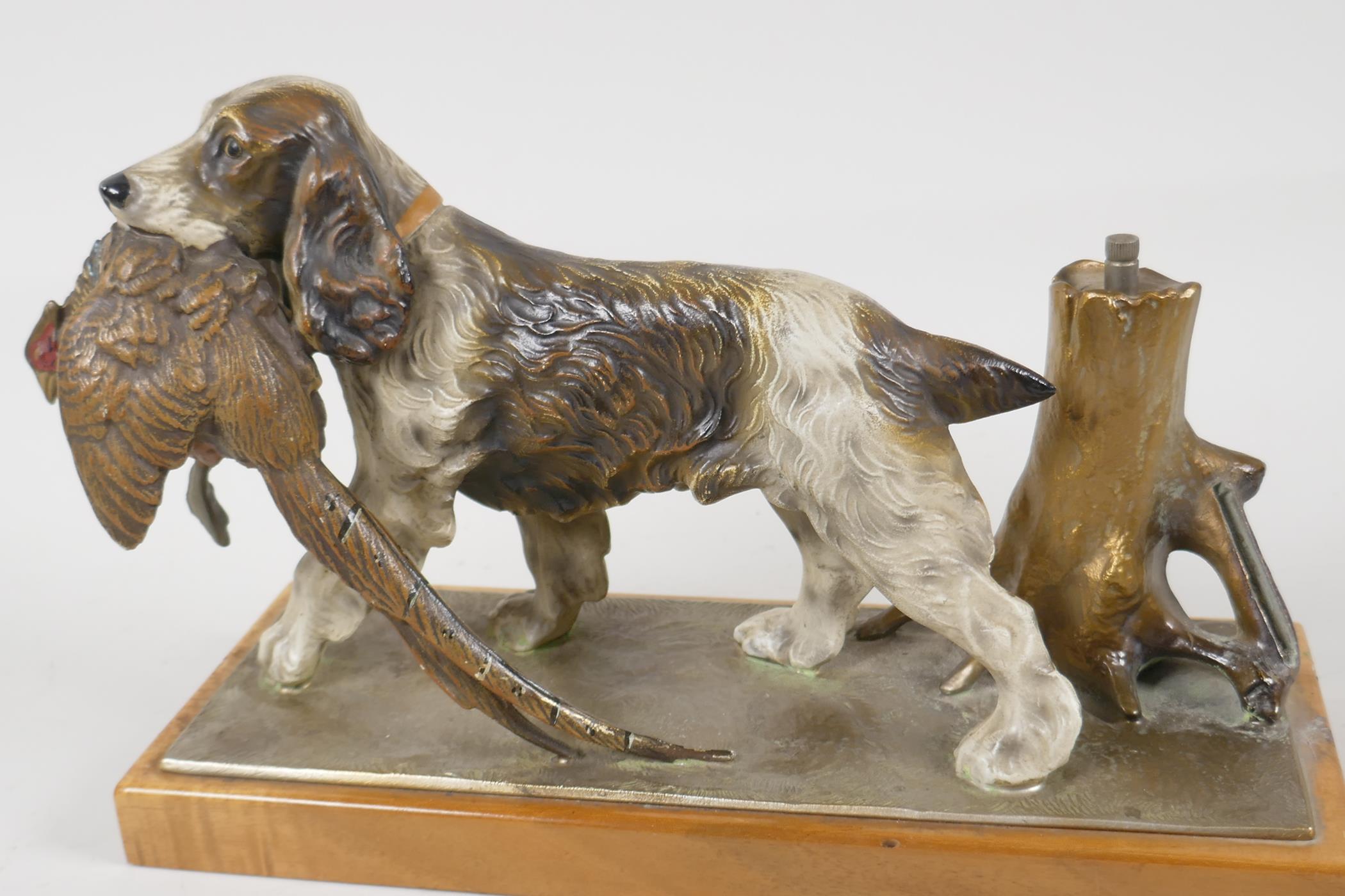 A novelty gold painted metal table lighter, in the form of a gun dog, with pheasant in it's mouth. - Image 2 of 3