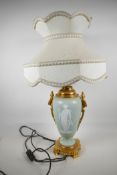 An Ormolu, mounted jasperware style, ceramic table lamp. Decorated with embossed classical figure on