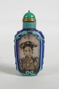 A Chinese reverse decorated glass snuff bottle depicting a Chinese lady and bamboo, 3" high