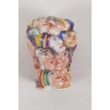 A Capo di Monte porcelain cane handle, modelled as many heads. 1½" long