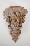 An ornately carved wood wall bracket. Carved in the form of a classical column capital. 13" long