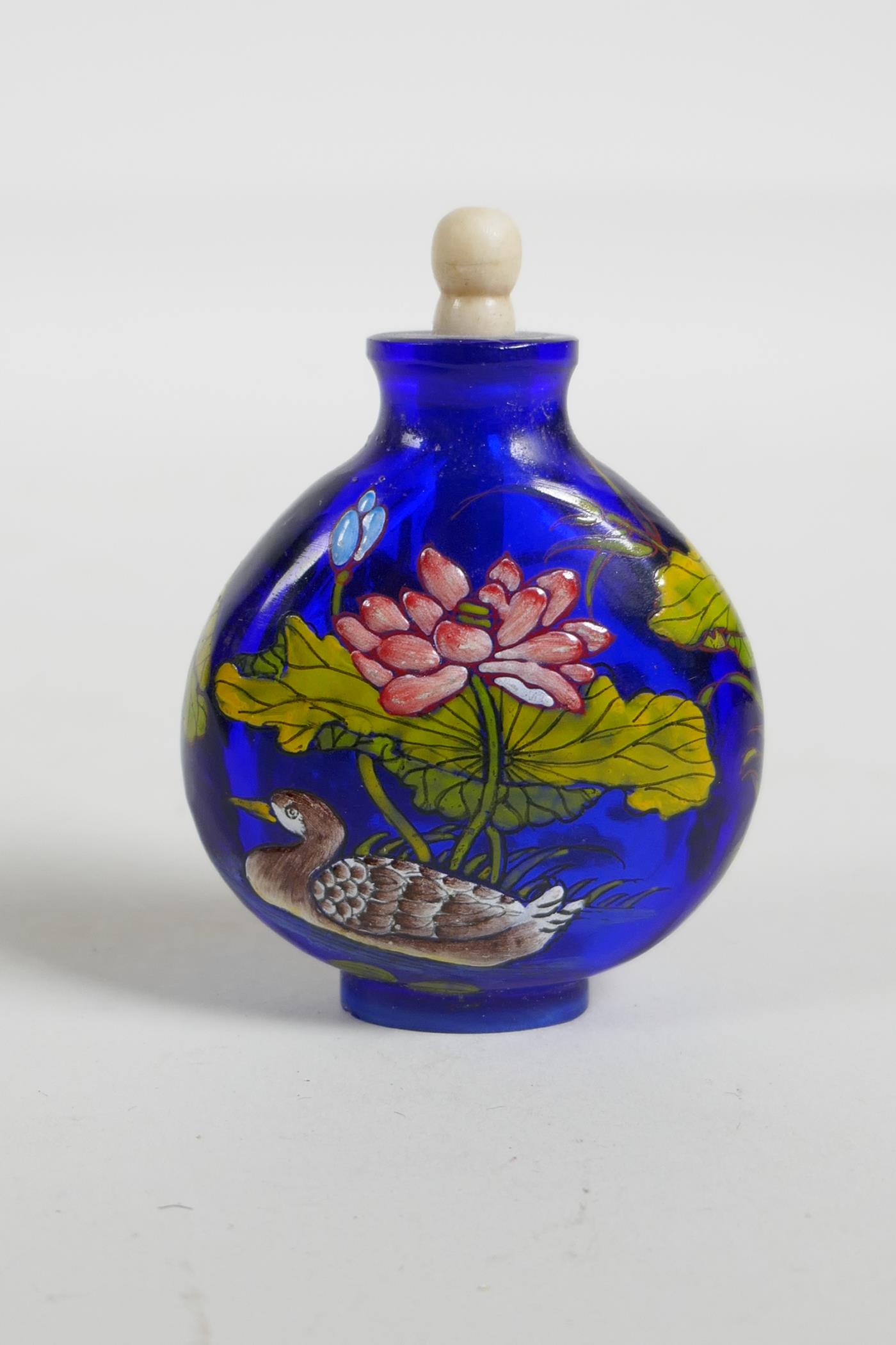An enamelled blue Peking glass snuff bottle, decorated with waterfowl in a lotus pond, three - Image 3 of 5