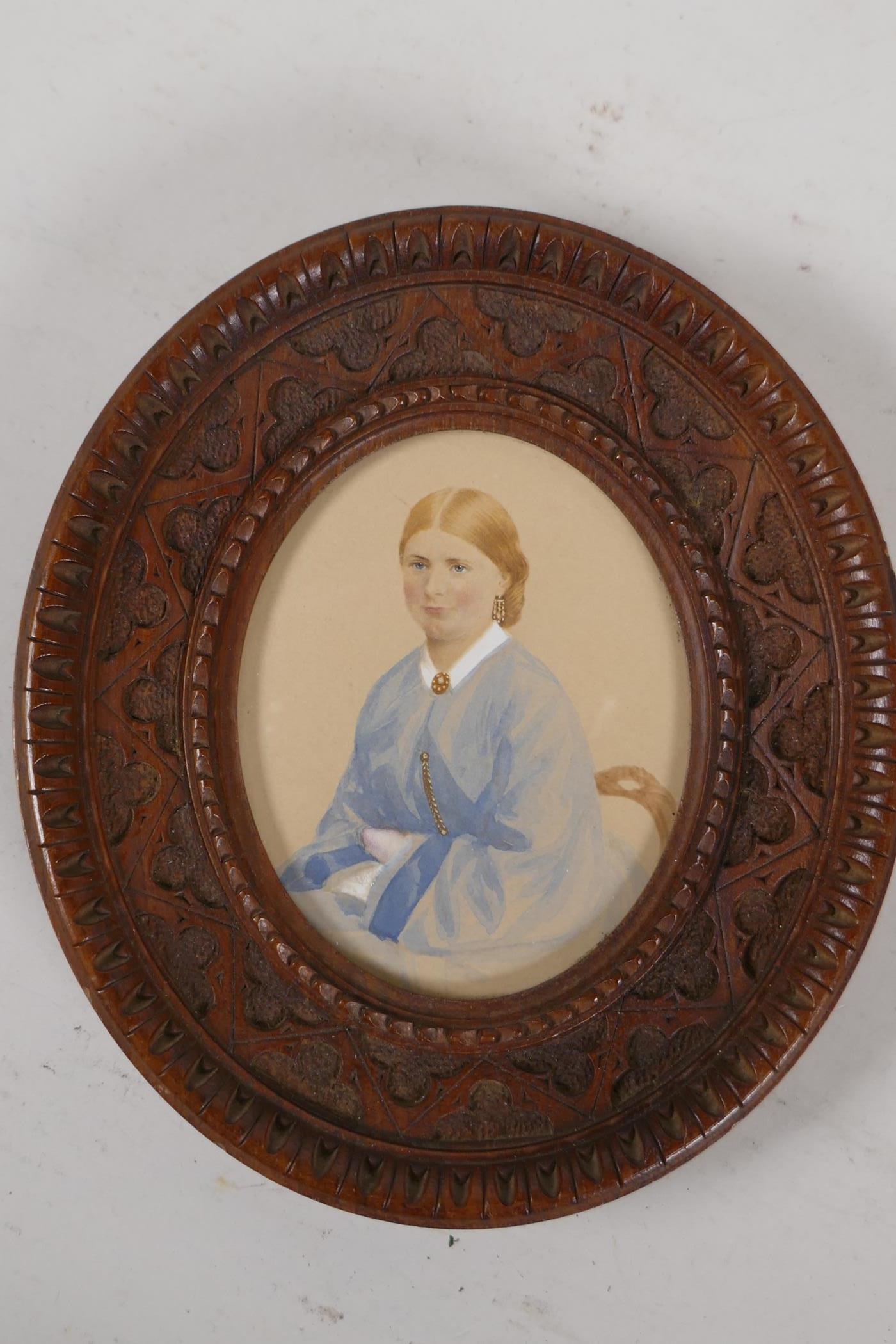 A miniature portrait of a lady, in a good oval carved oak frame. 5¾" x 5" overall - Image 2 of 2