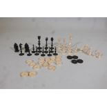 An early C19th, Indian ivory & horn chess set, King 4" high, set incomplete and chequers pieces