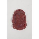 A Chinese agate amulet with carved decoration of a monkey riding a pony. 1½" x 2"