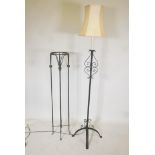A wrought metal standard lamp and a torchere stand 50" high