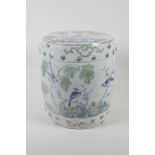 A Chinese pottery barrell stool/garden seat, with green & blue decoration of birds pearched in