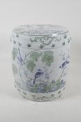 A Chinese pottery barrell stool/garden seat, with green & blue decoration of birds pearched in