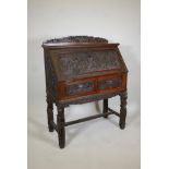 Chinese hardwood fall front bureau, with fitted interior over two frieze drawers, raised on four